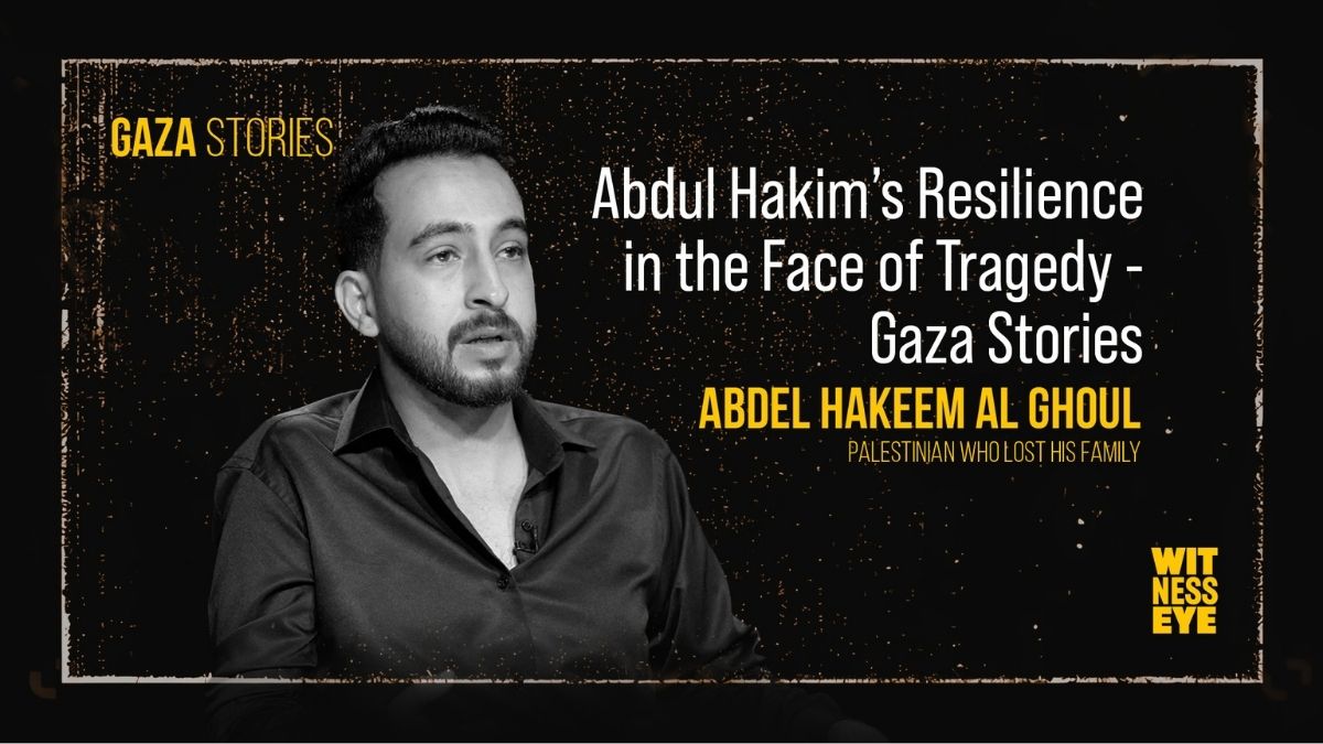 Portrait of Abdul Hakim Al-Ghoul working at his desk, reflecting determination and resilience after losing his family in Gaza.
