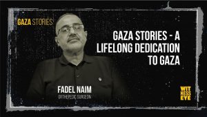 Dr. Fadel Naim walking through Beit Hanoun hospital corridors in Gaza, symbolizing lifelong medical dedication
